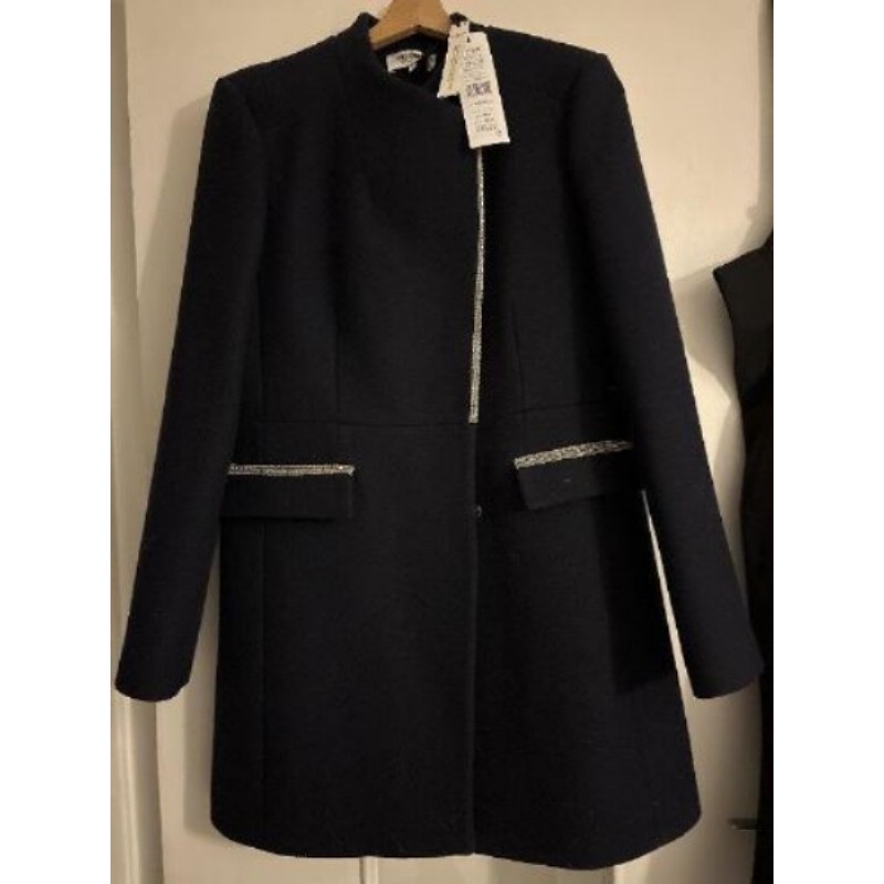 Manteau bleu taille avec De l’argenté sur les poches 