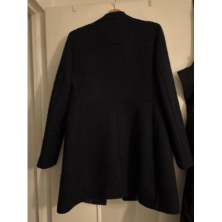 Manteau bleu taille avec De l’argenté sur les poches 