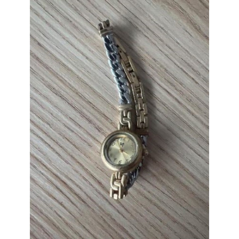 Montre femme Lip vintage couleur or et argent 