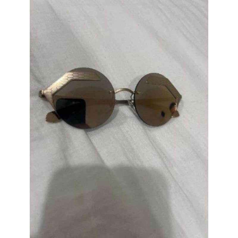 Lunettes de soleil Bulgari couleur or rose 