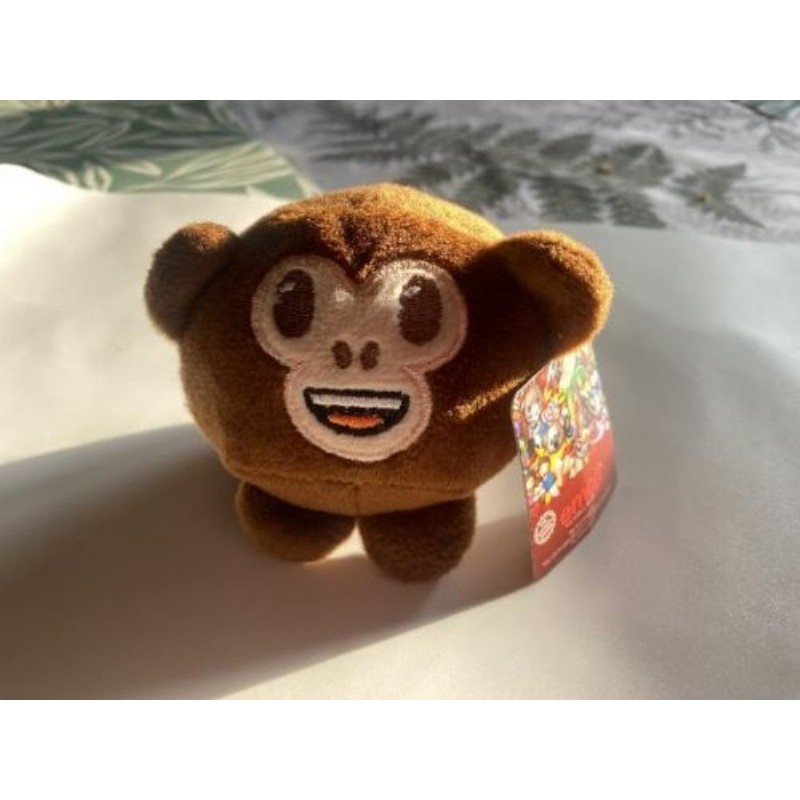 petit singe souriant - peluche emoji de 8cm à collectionner