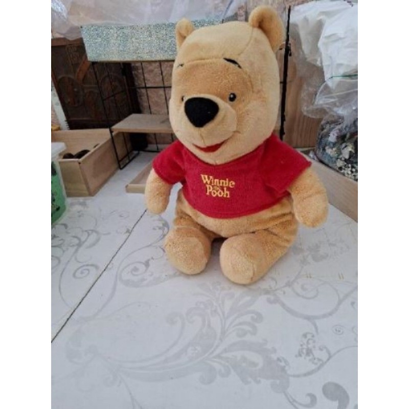 Winni l'ourson peluche