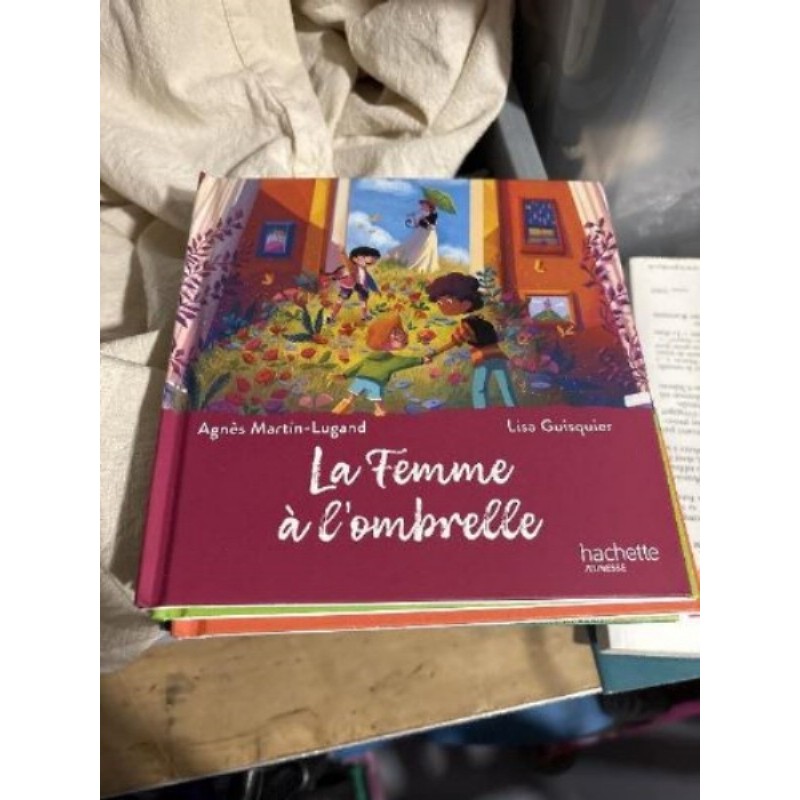 Livre la femme a l’ombrelle neuf 