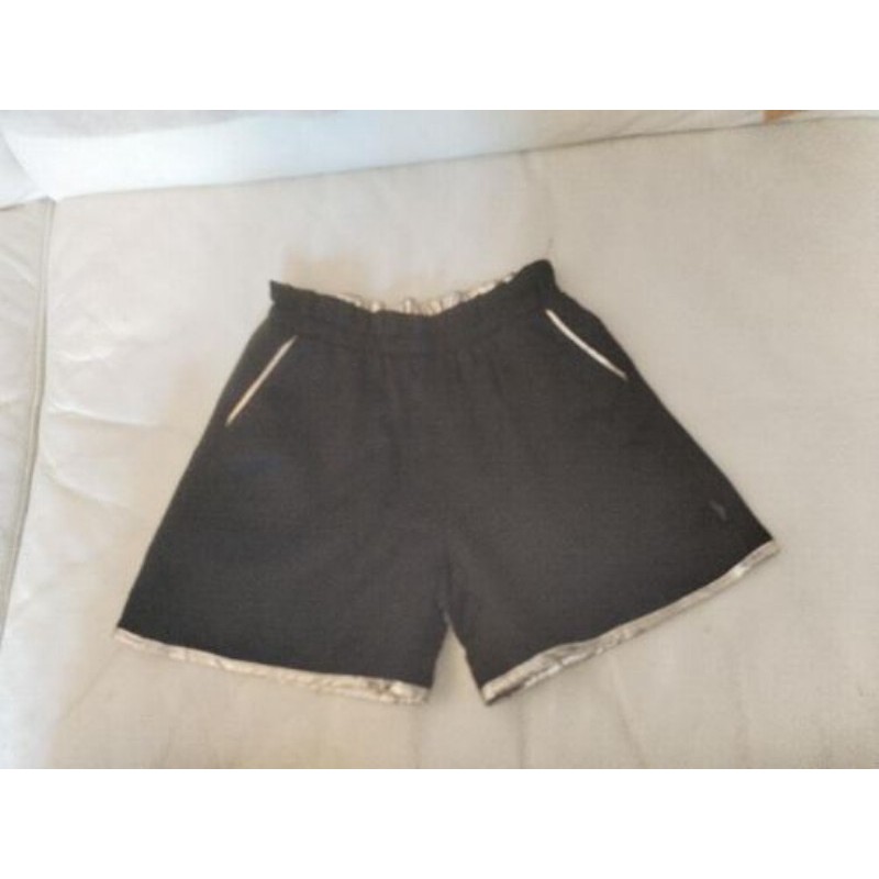 Short noir et doré ikks, réversible, 7 ans, très bon état 