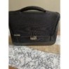 Cartable noir de la marque Delsey, état, impeccable, avec clé du cadenas, état neuf
