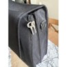 Cartable noir de la marque Delsey, état, impeccable, avec clé du cadenas, état neuf