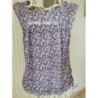 HAUT d'été sans manches motifs points lilas blanc gris. Finition en bas élastique avec cordon. Marqu