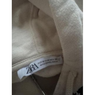 Sweat beige sans manches...