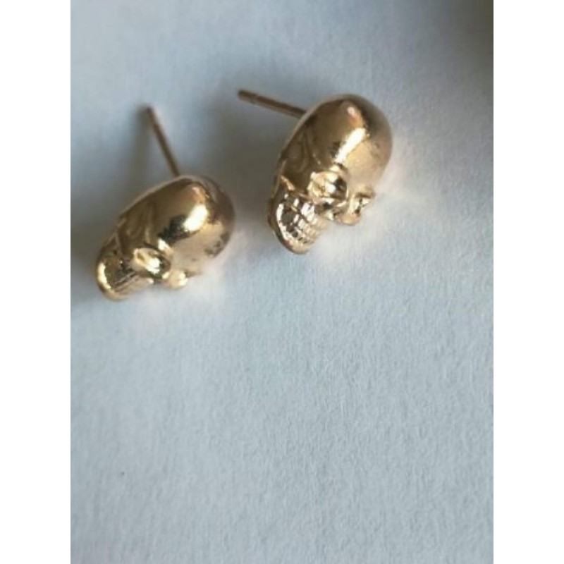 boucle d'oreille clou tete de mort doré alliage de zinc