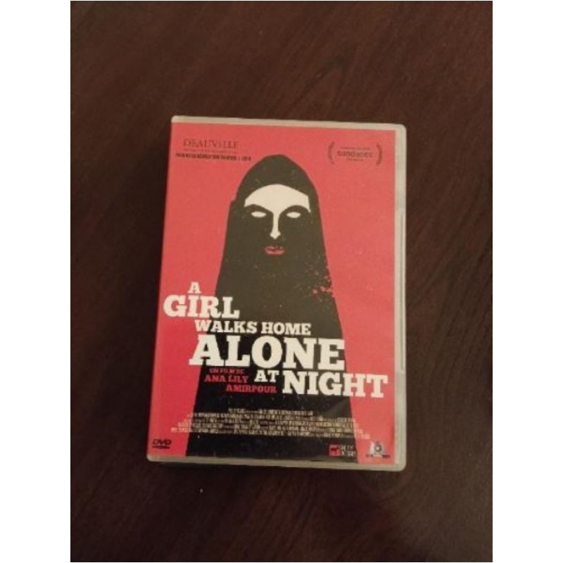 A girl walks home alone at night