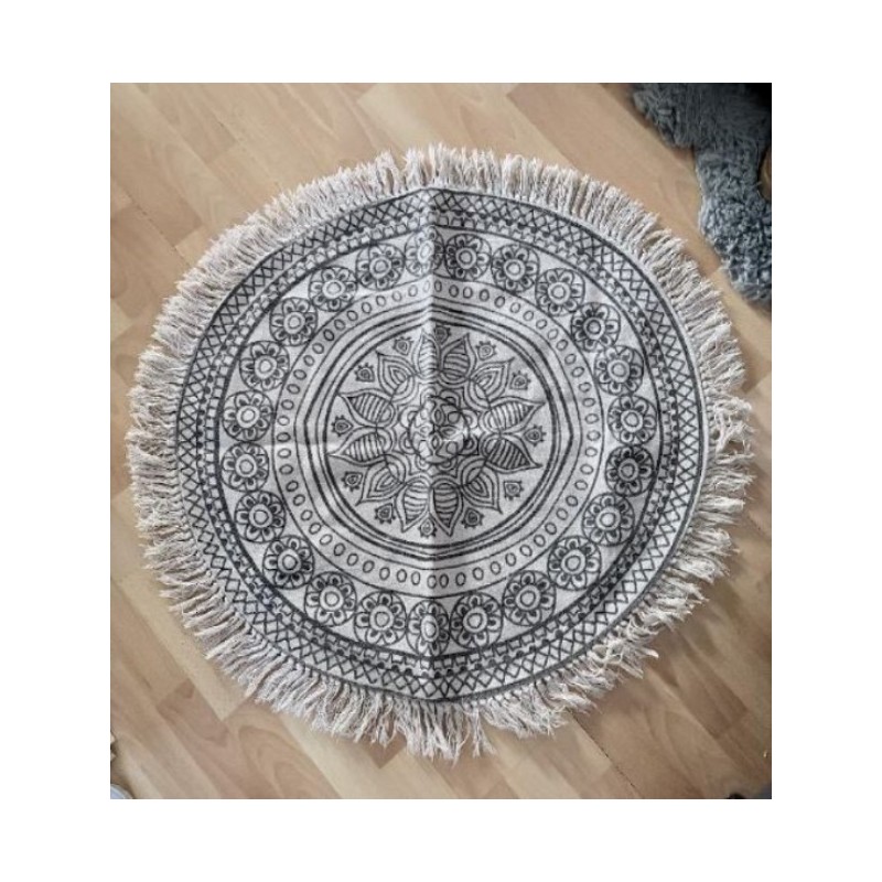 Tapis rond beige à motif noir